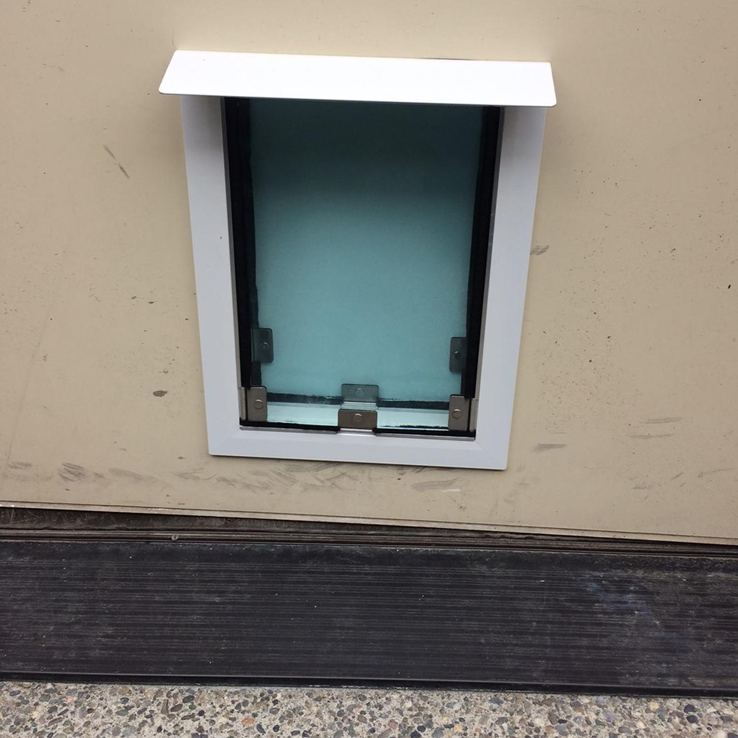Installing dog door in wall clearance
